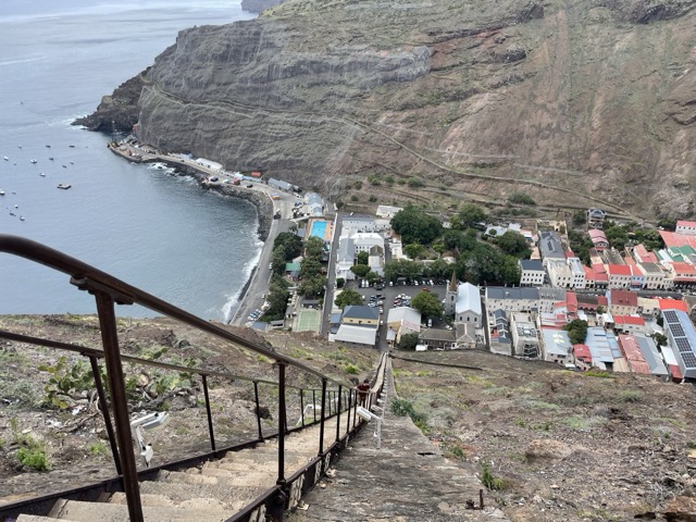View to a town from the top of a very steep, long staircase